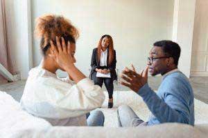 A couple discussing with a counselor how to make a child comfortable in two homes