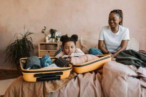 mother-and-daughter-packing-a-suitcase