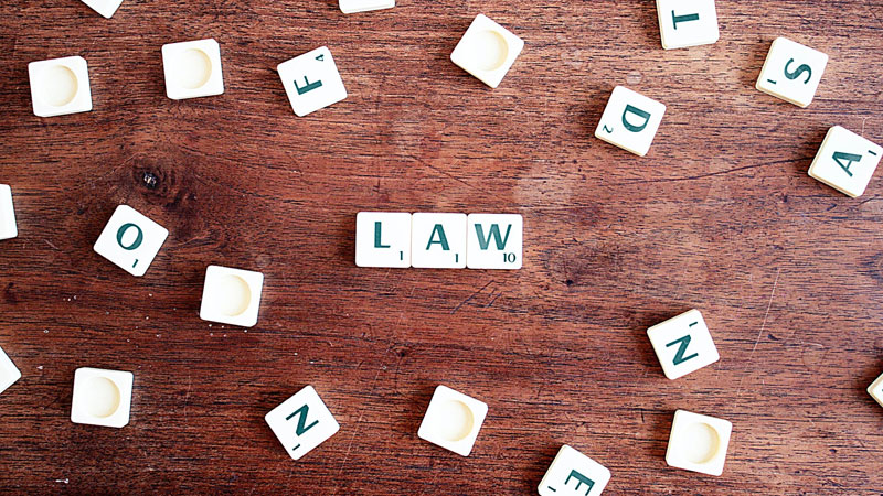 The word “law” is written in white blocks with letters.