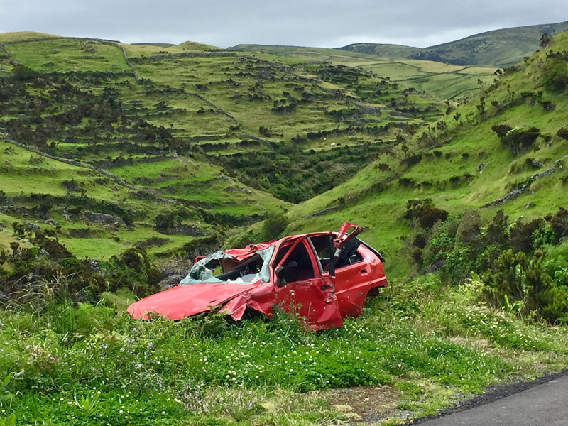 A picture of a wrecked car while the people are filing a car accident injury claim. 