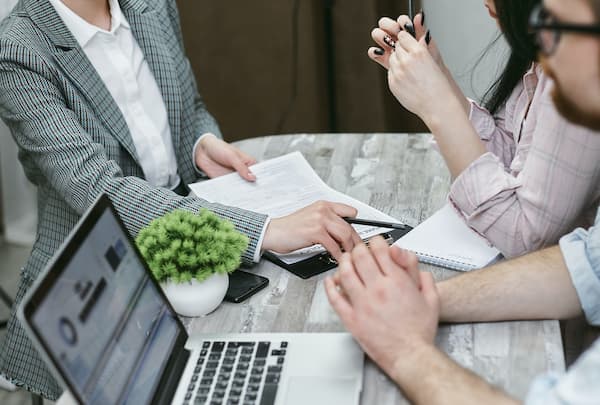 people in a meeting dealing with insurance companies after an injury