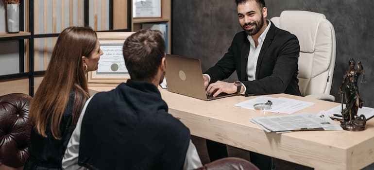 an attorney explaining to clients how to negotiate with insurance companies after an accident